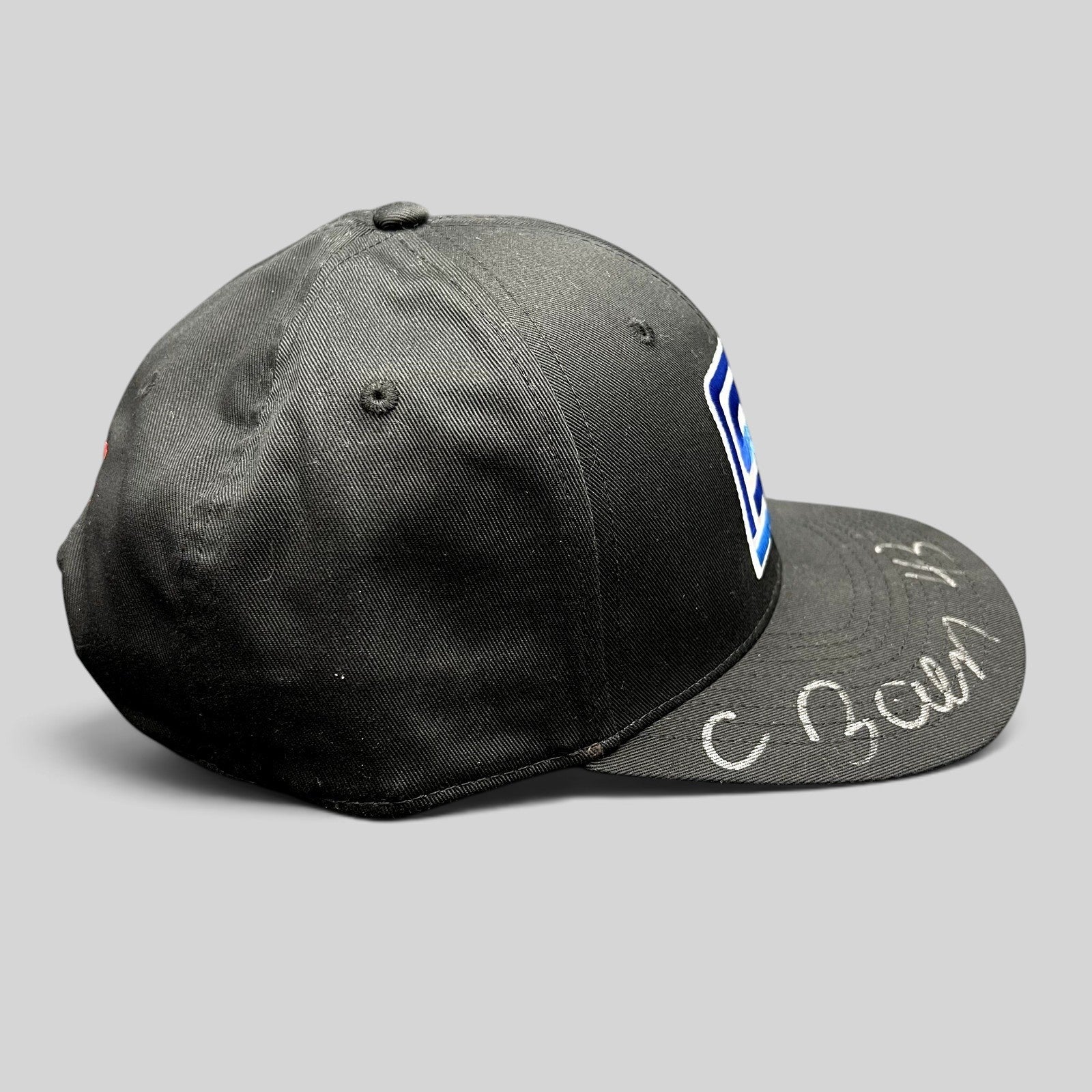Raree Finds black snapback hat with blue and white Spears logo and silver autograph on the brim