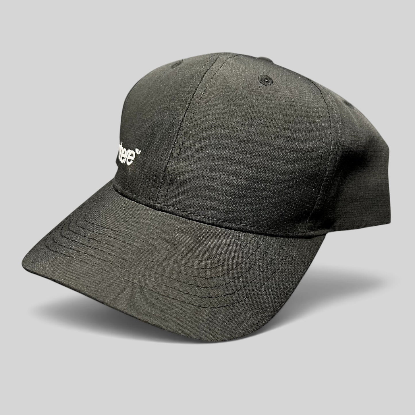 Raree Finds black strapback hat with white Sphere logo embroidery, unstructured polyester cap with curved brim.