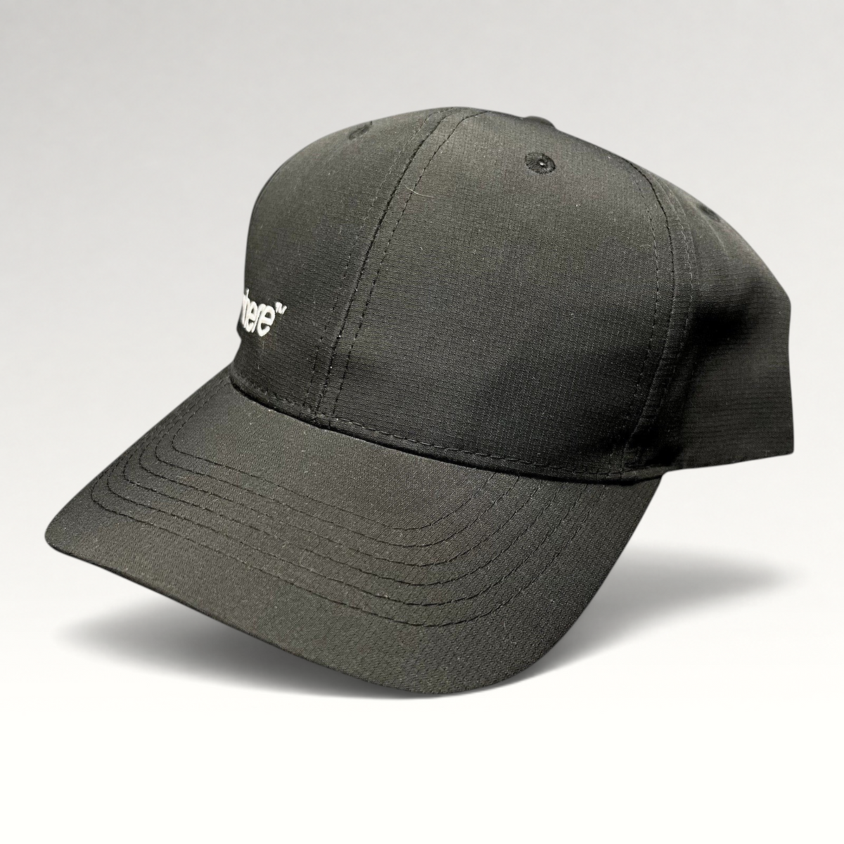 Raree Finds black strapback hat with white Sphere logo embroidery, unstructured polyester cap with curved brim.