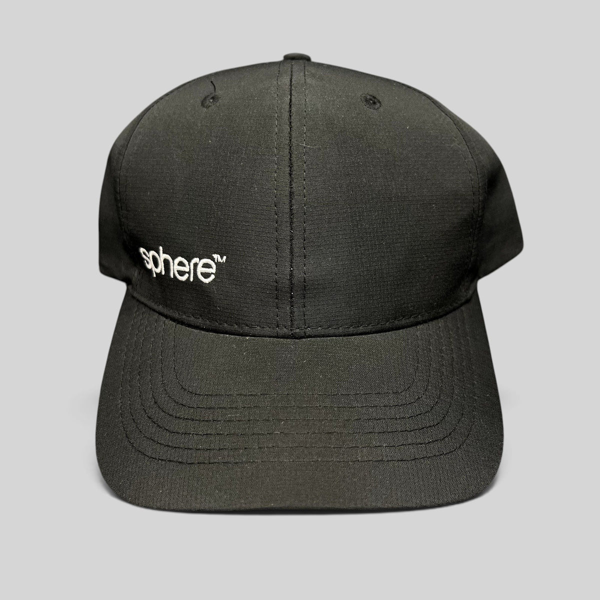 Raree Finds black strapback hat with white sphere embroidery on the front panel and a curved brim