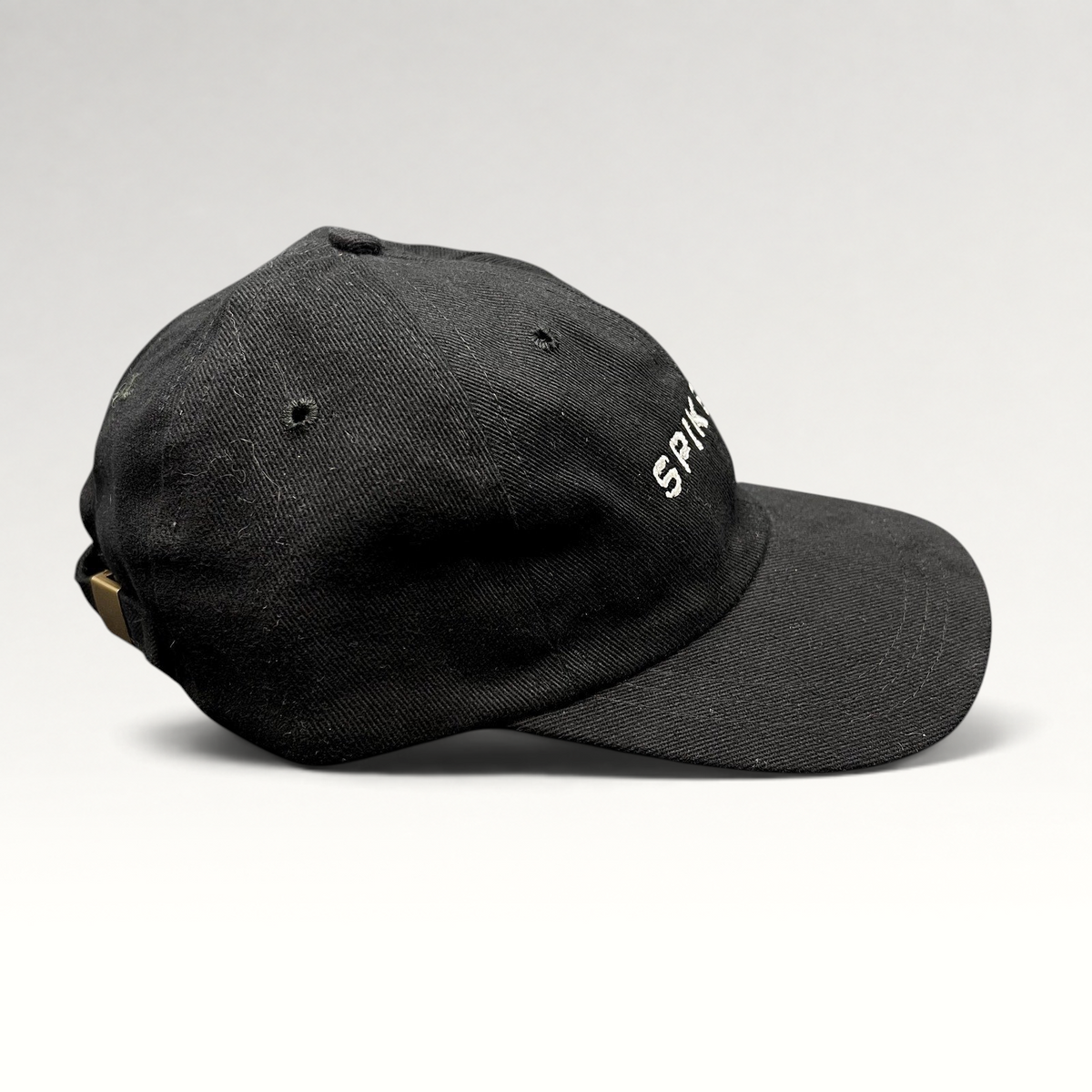 Raree Finds vintage black brushed cotton strapback hat with white and gold SPIKE DDB logo embroidery