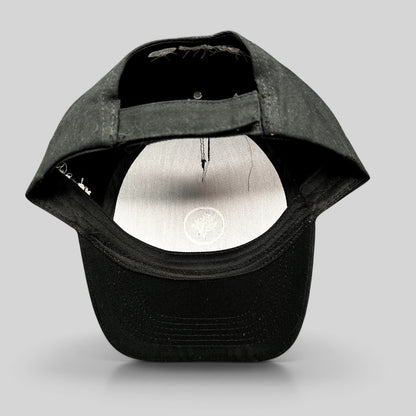 Raree Finds black Coral Gardeners strapback cap showing the adjustable rear strap and interior branding detail.