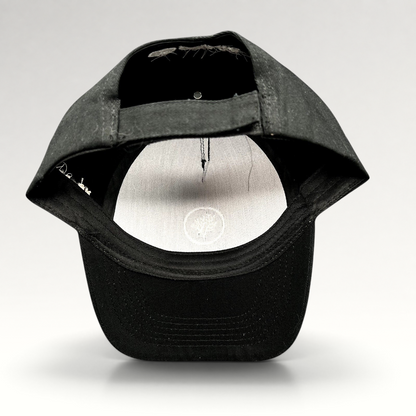 Raree Finds black Coral Gardeners strapback cap showing the adjustable rear strap and interior branding detail.