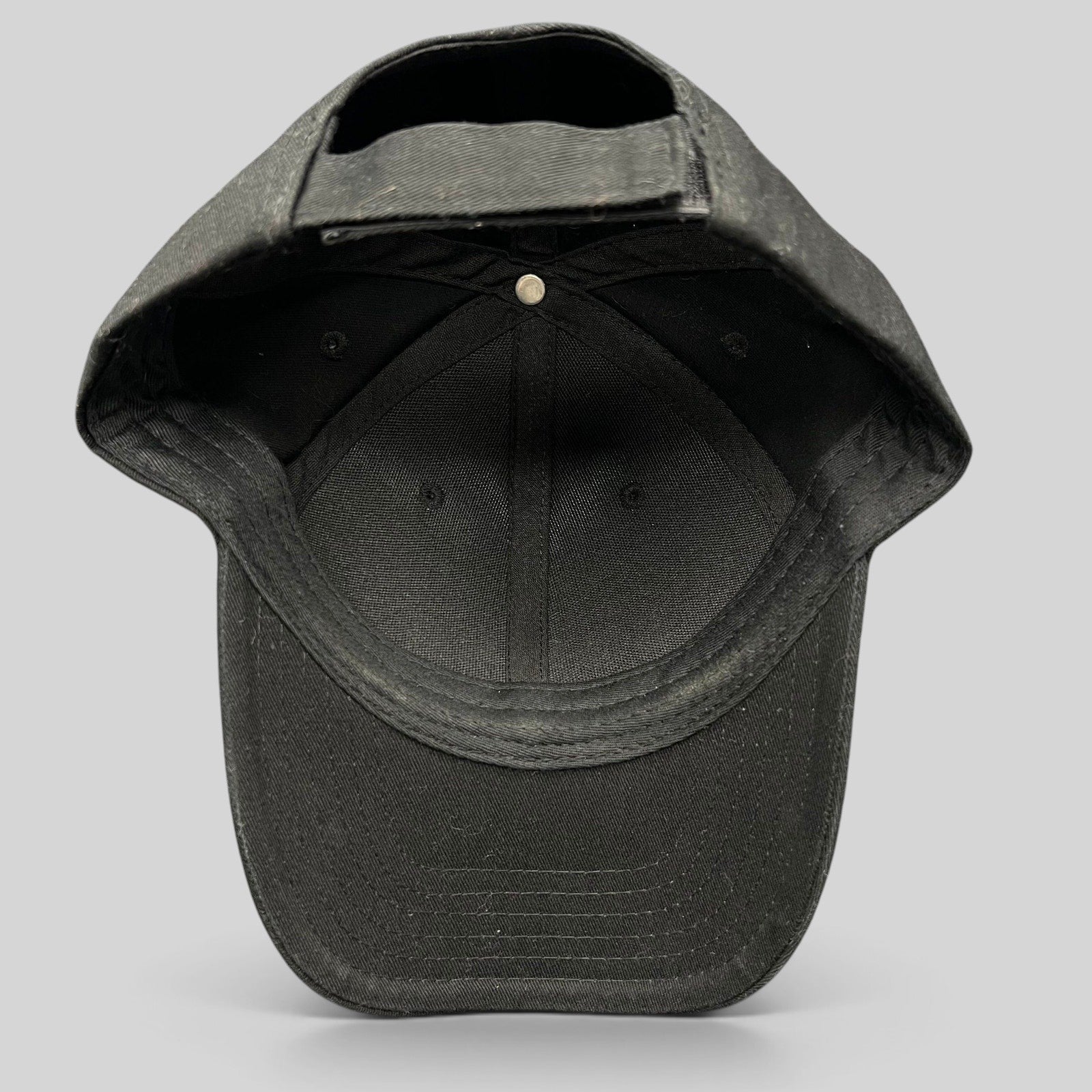Raree Finds black The Boring Company strapback hat interior view showing adjustable closure and structured cotton crown