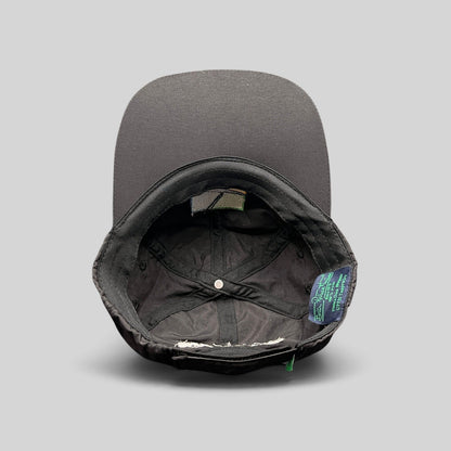 Raree Finds black unstructured strapback hat interior showing performance fabric lining and branded tag