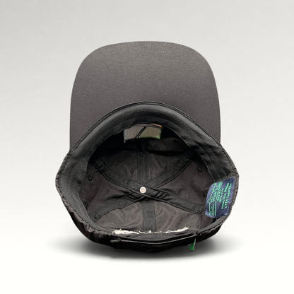 Raree Finds black unstructured strapback hat interior showing performance fabric lining and branded tag