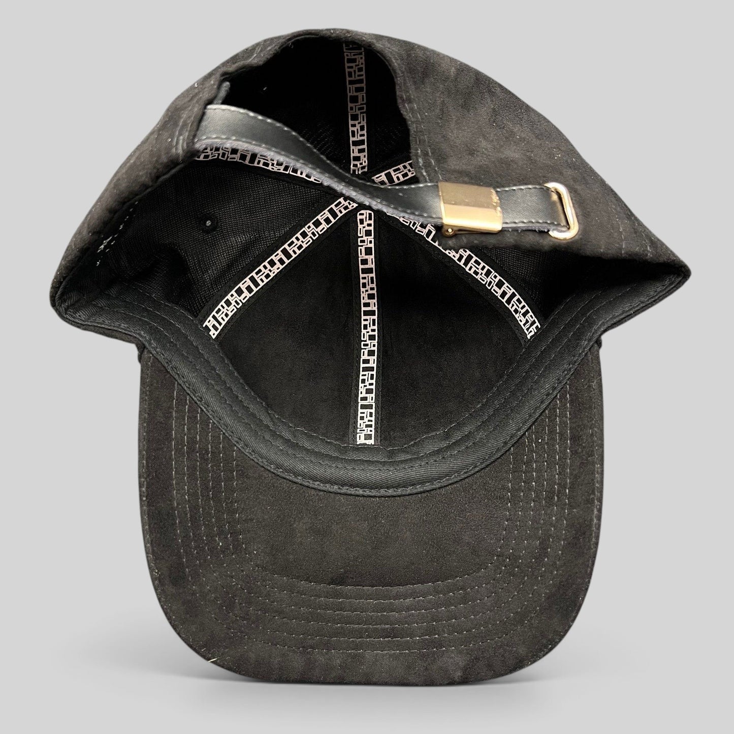 Raree Finds Metal Noir black unstructured strapback hat with leather strap and metal buckle, interior view