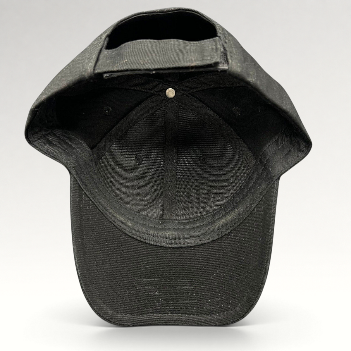 Raree Finds black The Boring Company strapback hat interior view showing adjustable closure and structured cotton crown