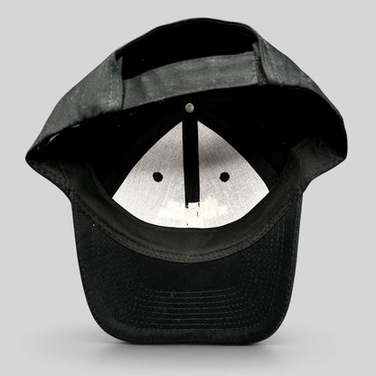 Raree Finds black Port & Company strapback hat showing the interior construction and adjustable back closure