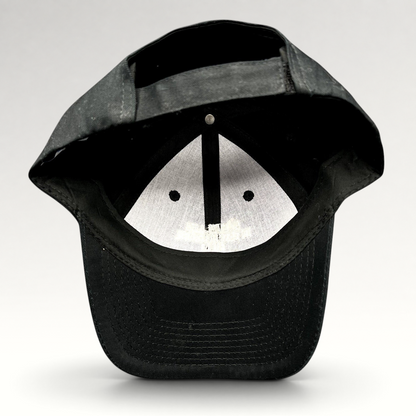 Raree Finds black Port & Company strapback hat showing the interior construction and adjustable back closure