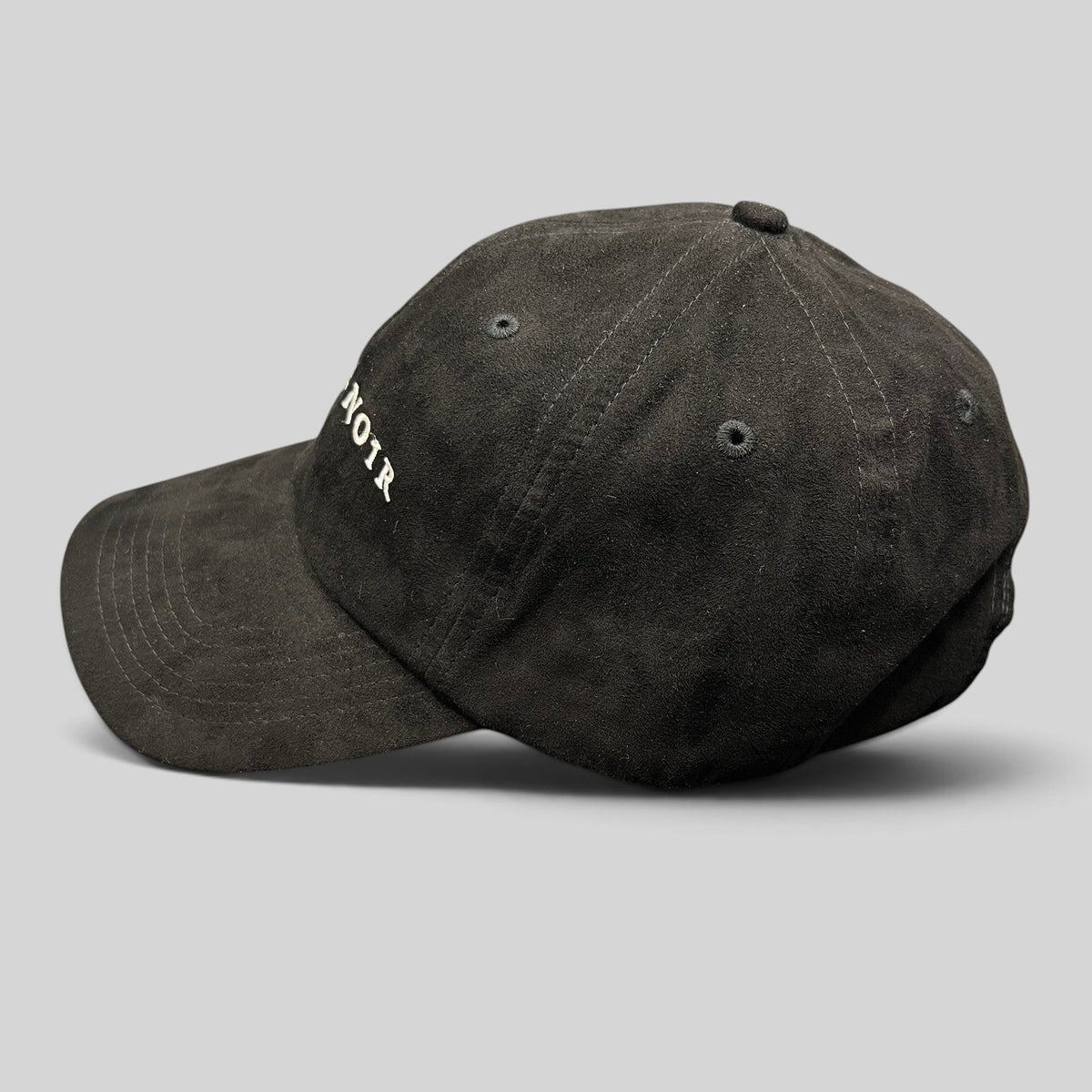 Raree Finds black unstructured strapback hat with white Metal Noir embroidery and a curved brim