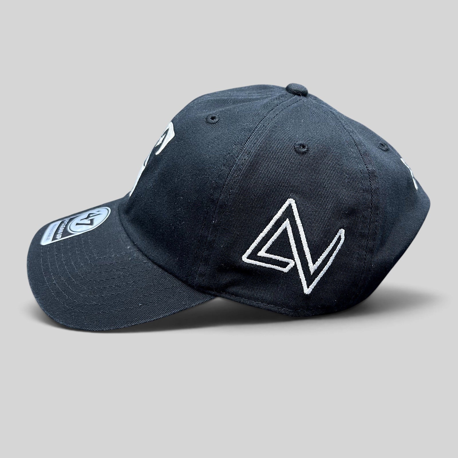 Raree Finds 47 Brand black cotton strapback hat with white embroidered S logo and side detail on a curved brim