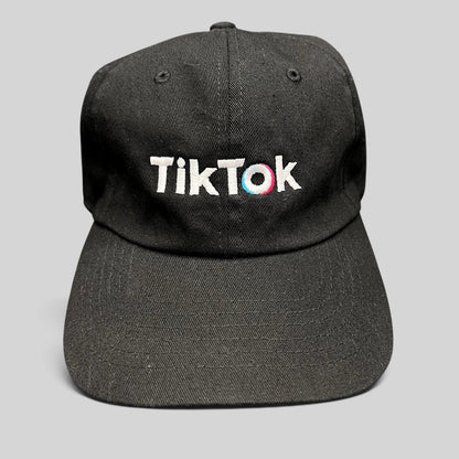 Raree Finds black TikTok dad cap with white embroidered logo and teal and pink accent stitching on a curved brim hat.