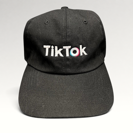 Raree Finds black TikTok dad cap with white embroidered logo and teal and pink accent stitching on a curved brim hat.