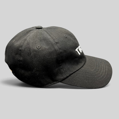 Raree Finds black cotton dad cap with embroidered white TikTok logo and curved brim, side profile view.