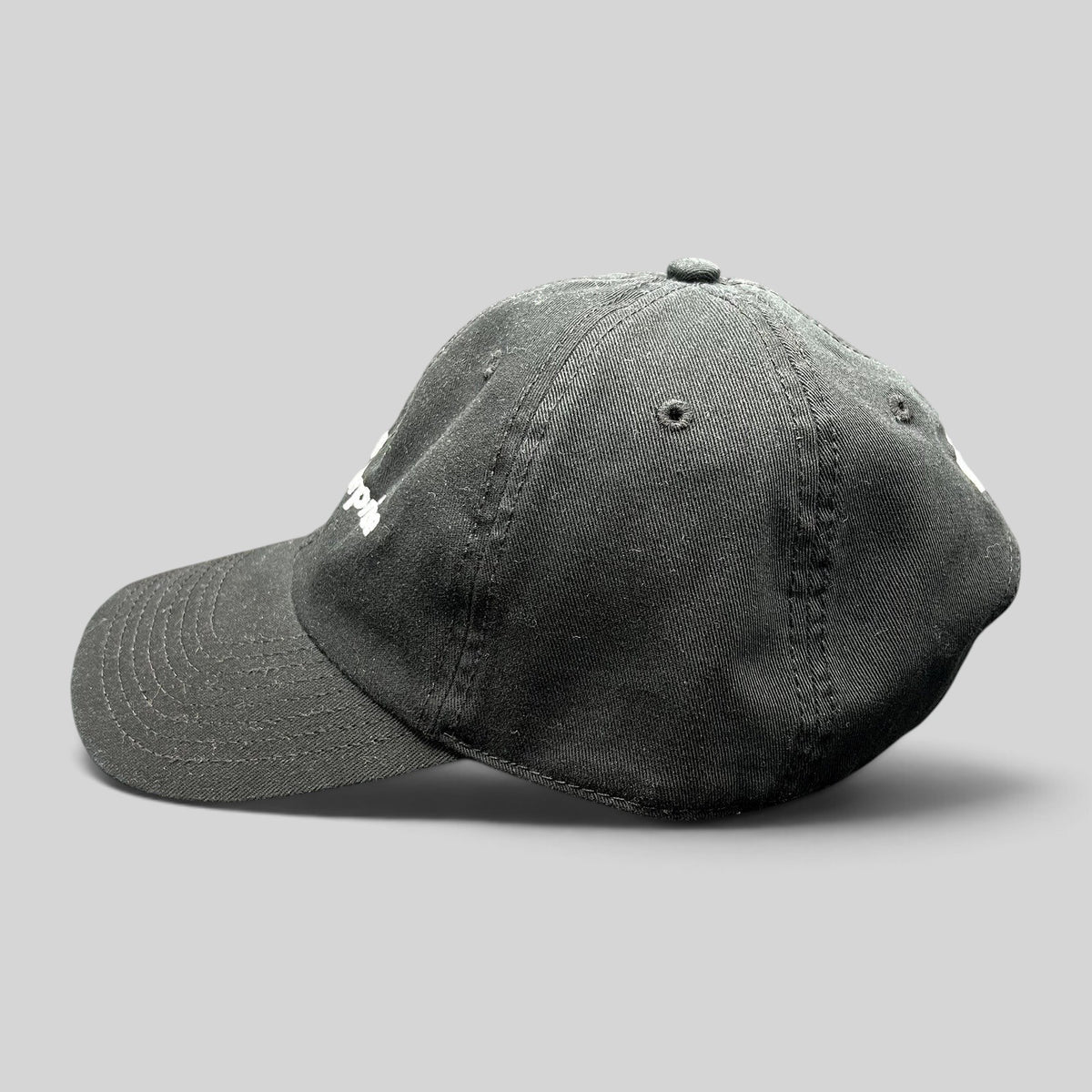 Raree Finds black TikTok US Enterprise Team strapback hat with curved brim and embroidered logo, side profile view.