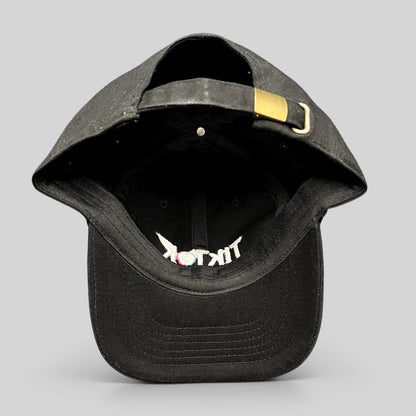 Raree Finds black TikTok dad cap with adjustable strapback closure, metal buckle, and embroidered logo on the brim.