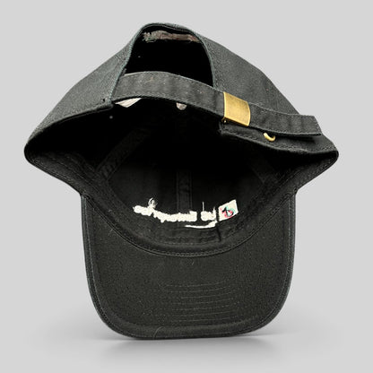 Raree Finds black TikTok strapback hat showing the interior, adjustable strap, and brass buckle hardware.