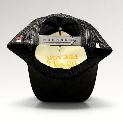 Raree Finds Are You Kozy? black trucker hat showing the interior mesh lining and adjustable Otto snapback closure