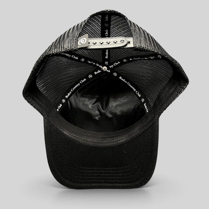 Raree Finds black Rodeo Country Club trucker hat showing interior mesh panels and adjustable snapback closure
