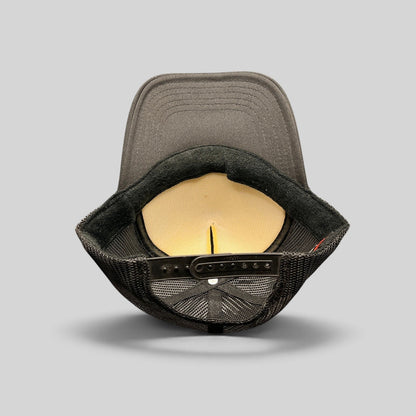 Raree Finds Doheny Room black trucker hat interior view showing foam lining, mesh back, and adjustable snapback strap.
