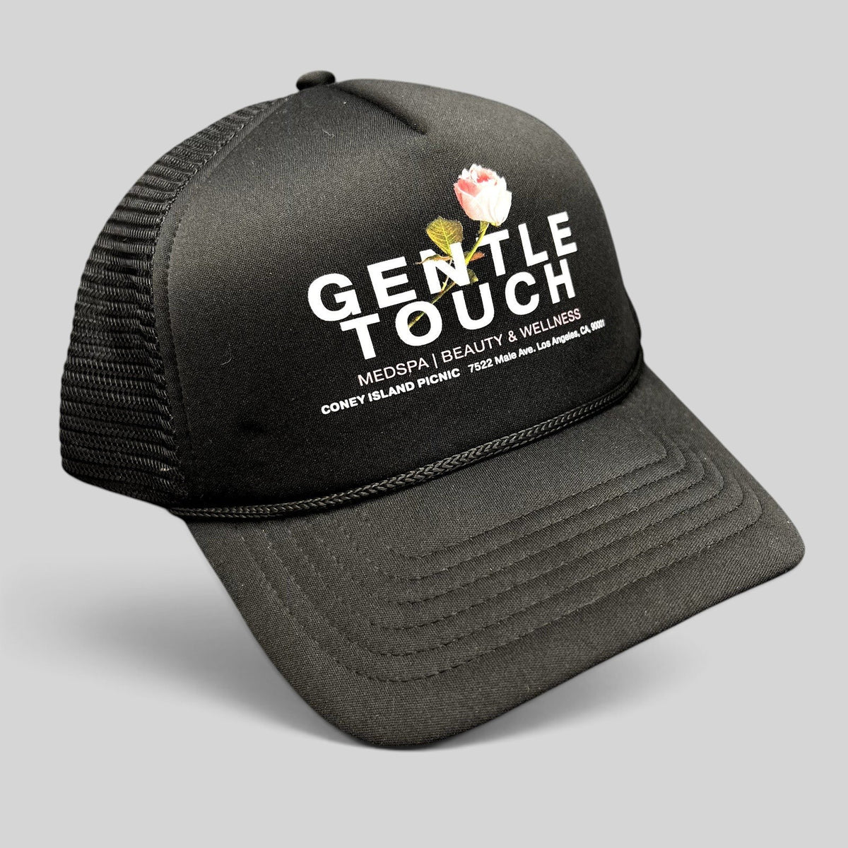 Raree Finds black Coney Island Picnic trucker hat with Gentle Touch MedSpa rose graphic and adjustable snapback closure