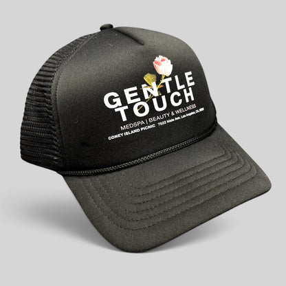 Raree Finds black Coney Island Picnic trucker hat with Gentle Touch MedSpa rose graphic and adjustable snapback closure