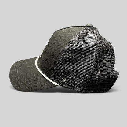 Raree Finds black trucker hat with breathable mesh back, white rope detail, and curved bill from Discovery Collection.