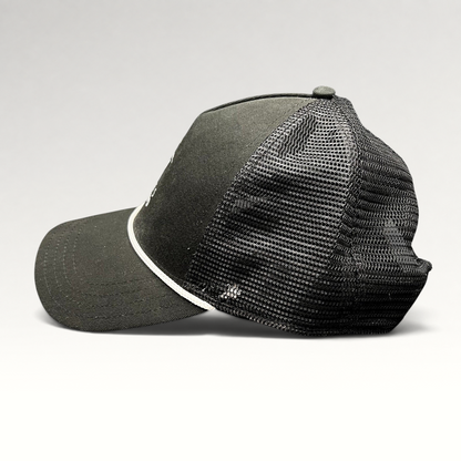 Raree Finds black trucker hat with breathable mesh back, white rope detail, and curved bill from Discovery Collection.