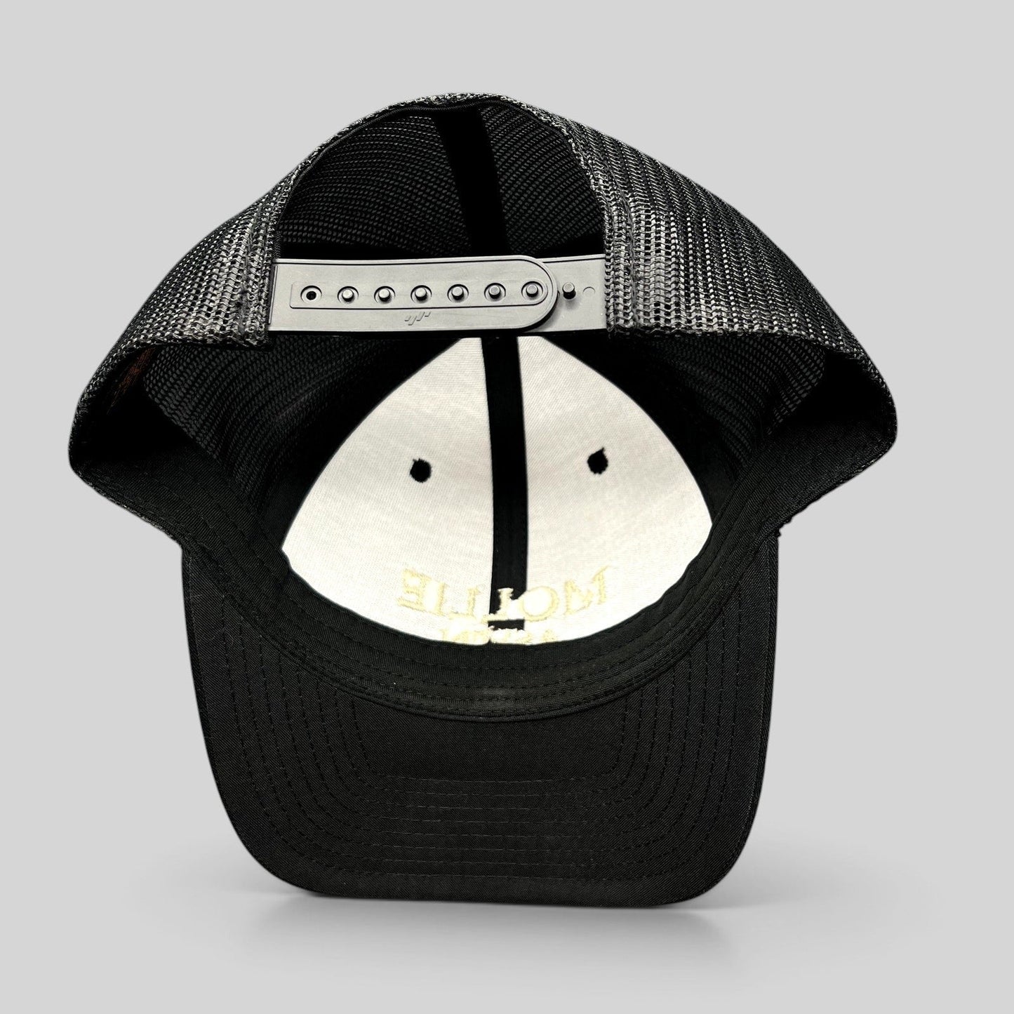 Raree Finds black Yupoong Classics trucker hat with adjustable snapback closure and breathable mesh back panels