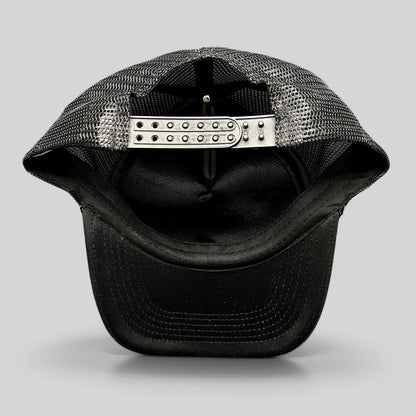 Raree Finds vintage black mesh trucker hat showing the adjustable plastic snapback closure and interior construction.