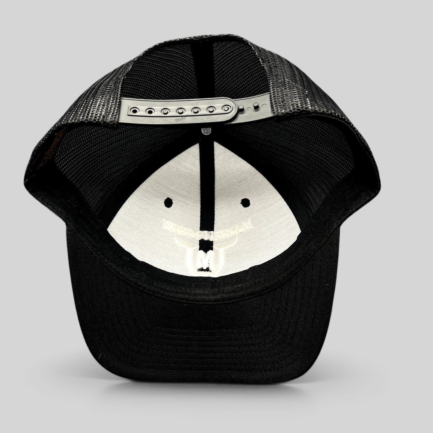 Raree Finds black and white Yupoong Classics trucker hat with adjustable snapback closure and mesh back panels
