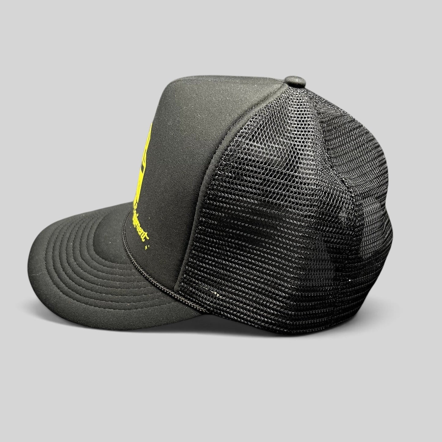 Raree Finds black foam trucker hat with yellow Ultra Specialized Equipment graphic, mesh back, and brim rope detail.