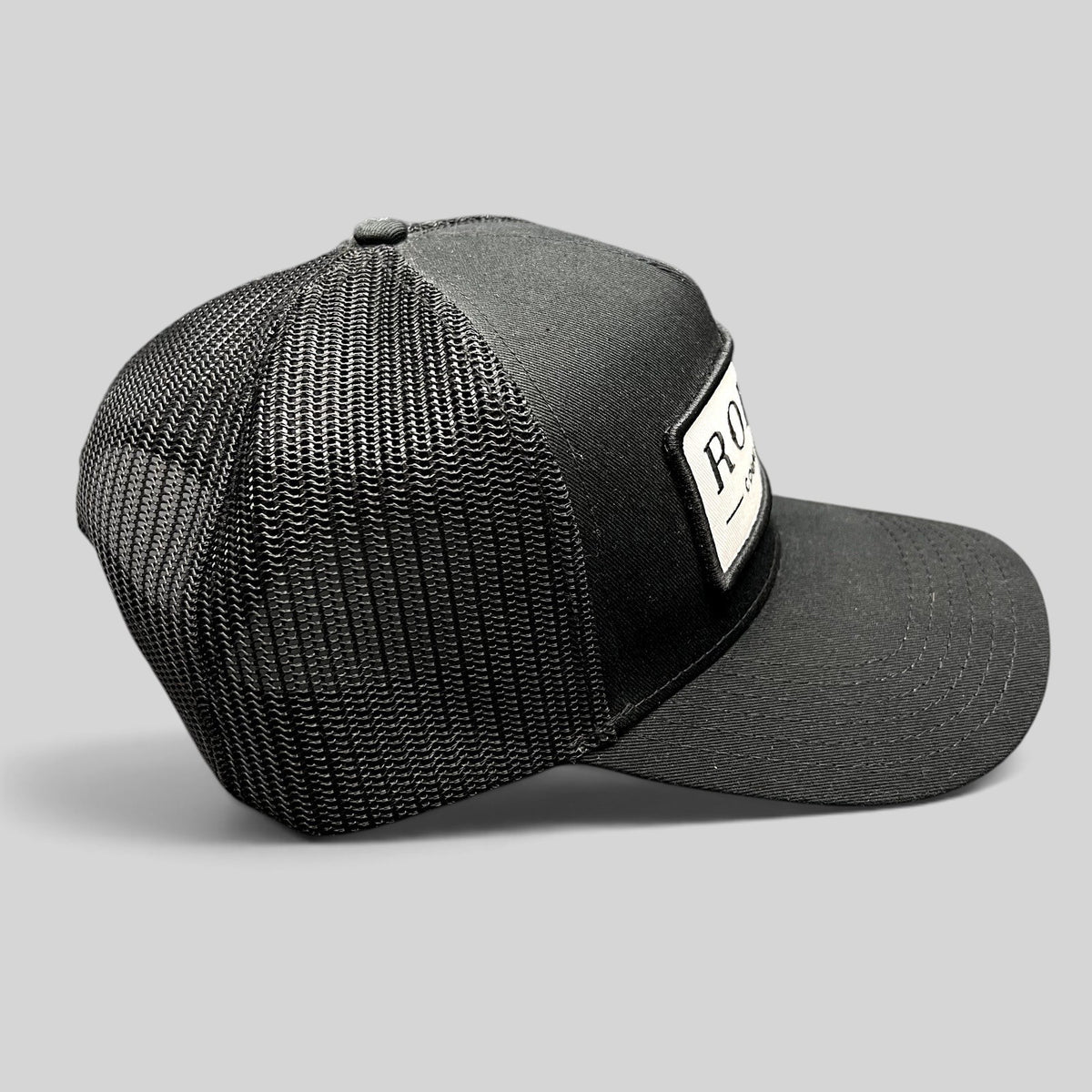 Raree Finds black Rodeo Country Club trucker hat with breathable mesh back and embroidered front patch