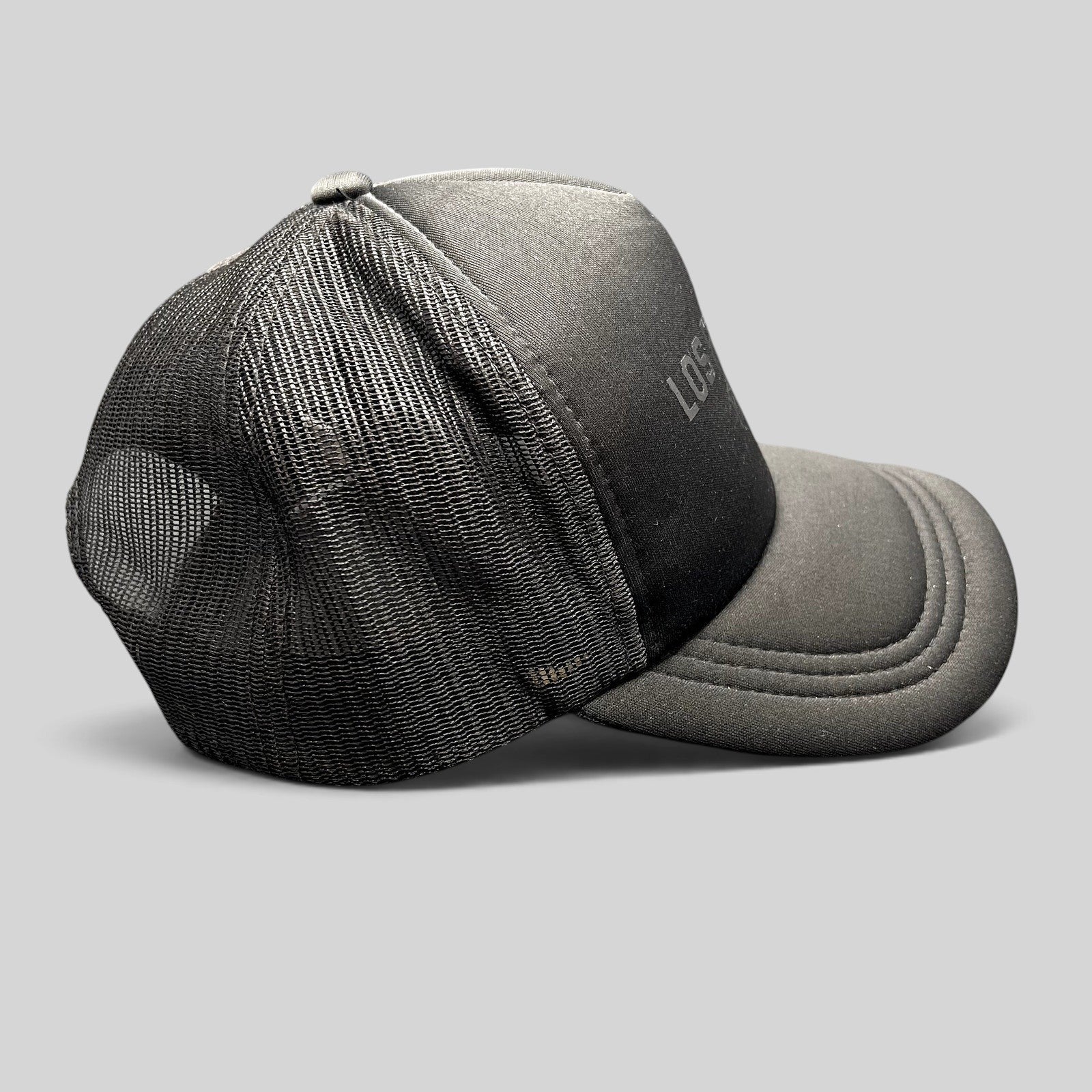 Raree Finds black Los Poblanos Ranch 1934 trucker hat with foam front, mesh back, and curved brim