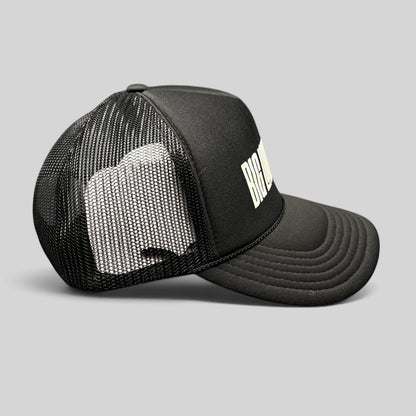 Raree Finds black Otto trucker hat with white BIG LOUD ROCK graphic, foam front, and breathable mesh back snapback.