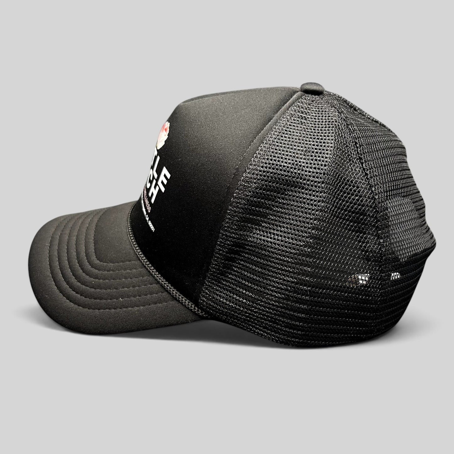 Raree Finds black Coney Island Picnic trucker hat with Gentle Touch MedSpa rose graphic and adjustable snapback