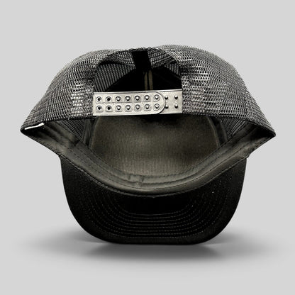 Raree Finds black trucker snapback hat showing the adjustable plastic strap and breathable mesh back panel