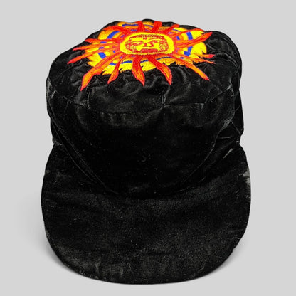Raree Finds vintage black velvet cap featuring a colorful embroidered southwestern sun face motif on the crown.