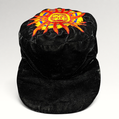 Raree Finds vintage black velvet cap featuring a colorful embroidered southwestern sun face motif on the crown.
