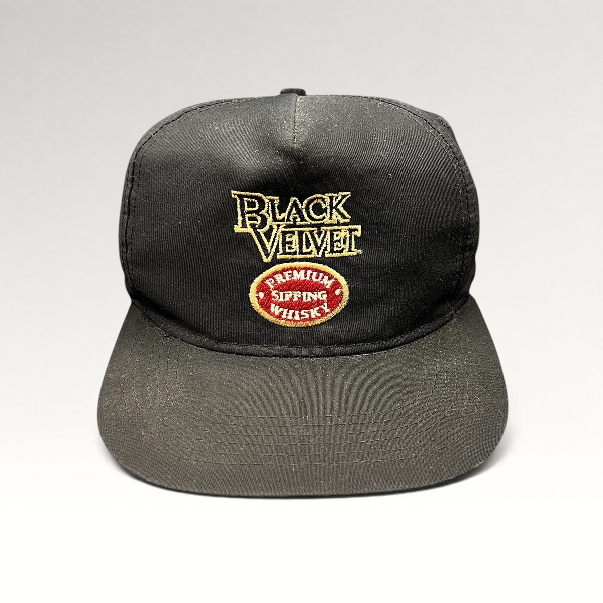 Raree Finds vintage black snapback hat featuring embroidered Black Velvet Premium Blended Whisky logo and crest