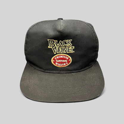 Raree Finds vintage black snapback hat featuring embroidered Black Velvet Premium Blended Whisky logo and crest.