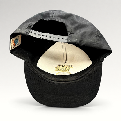 Raree Finds vintage Black Velvet Whisky snapback hat showing the interior label and adjustable plastic strap