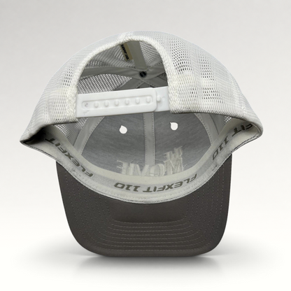 Raree Finds The Movie Guys black and white Flexfit 110 trucker hat with adjustable snapback and breathable mesh back