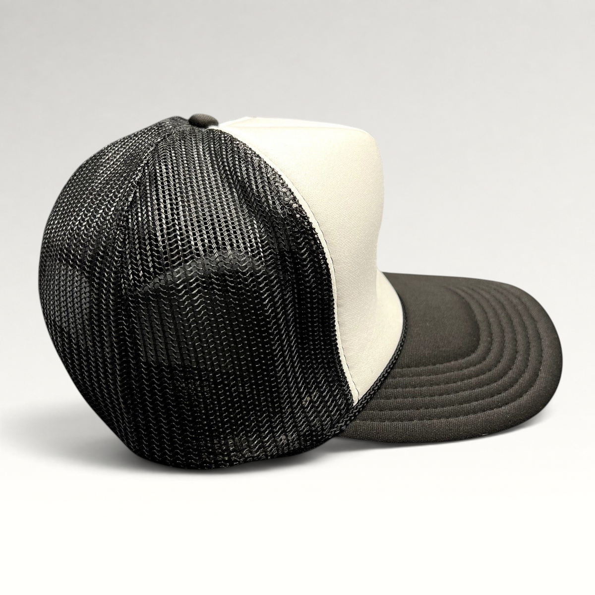 Raree Finds vintage OTTO trucker hat with black mesh back, white foam front, and curved black brim.