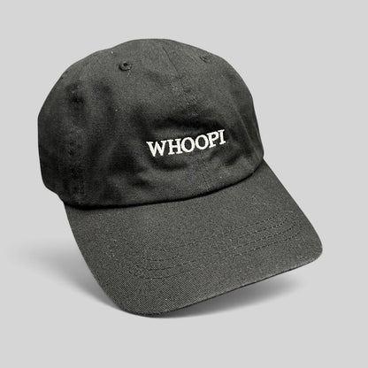 Raree Finds black organic cotton dad cap with white WHOOPI embroidery on the front and a curved brim