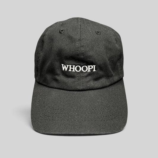 Raree Finds black organic cotton dad cap with white WHOOPI embroidery on the front and a curved brim