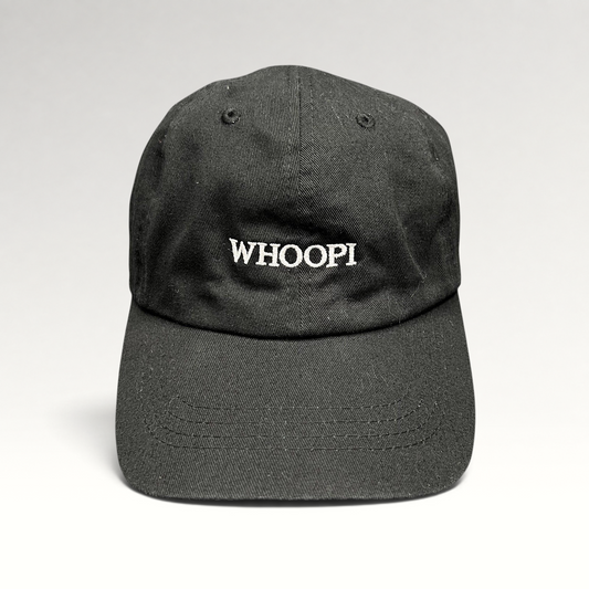 Raree Finds black organic cotton dad cap with white WHOOPI embroidery on the front and a curved brim