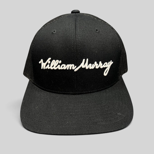 Raree Finds black William Murray Golf trucker hat with white script logo embroidery and structured mesh back
