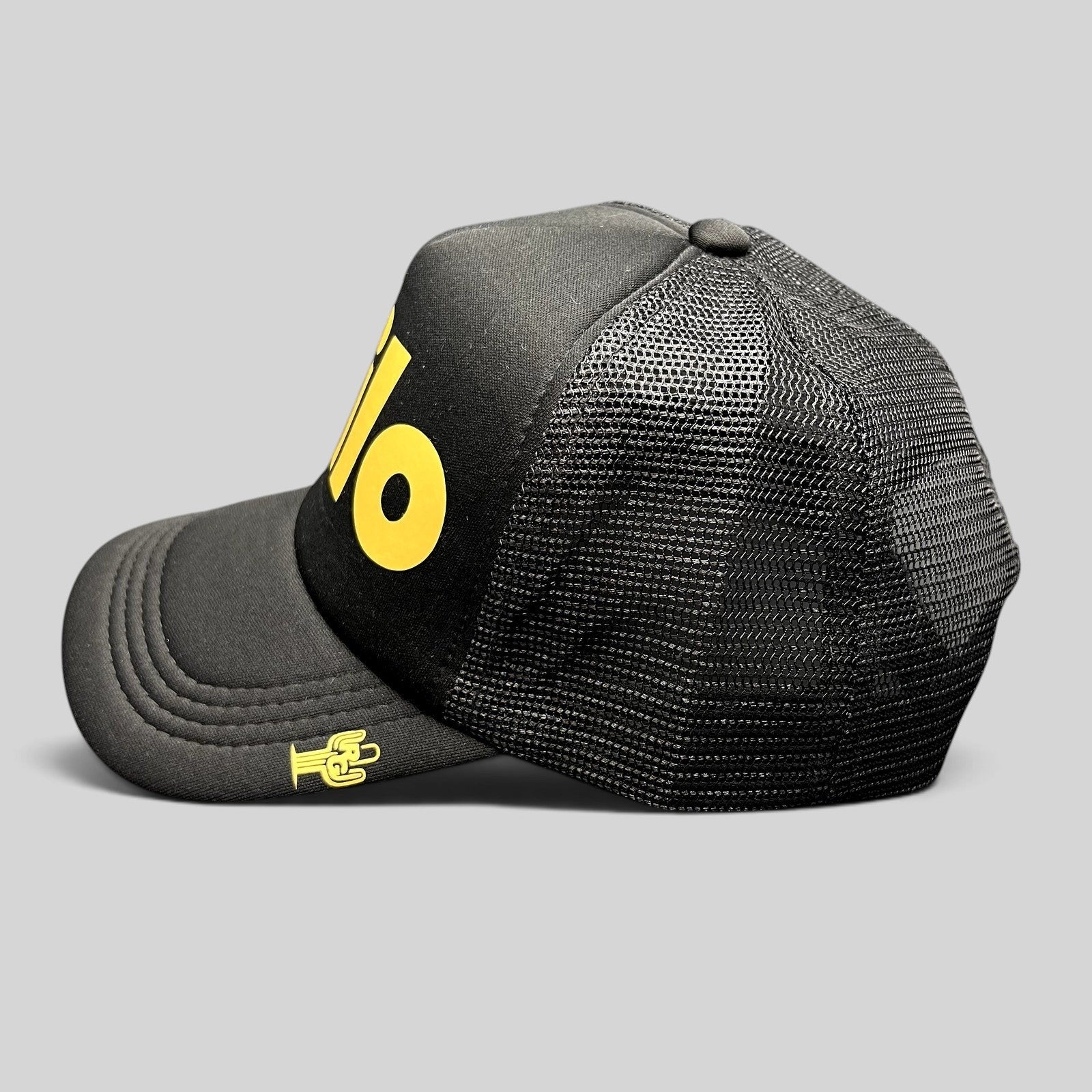 Raree Finds black foam trucker hat with yellow Milo front logo and small cactus embroidery on the curved brim